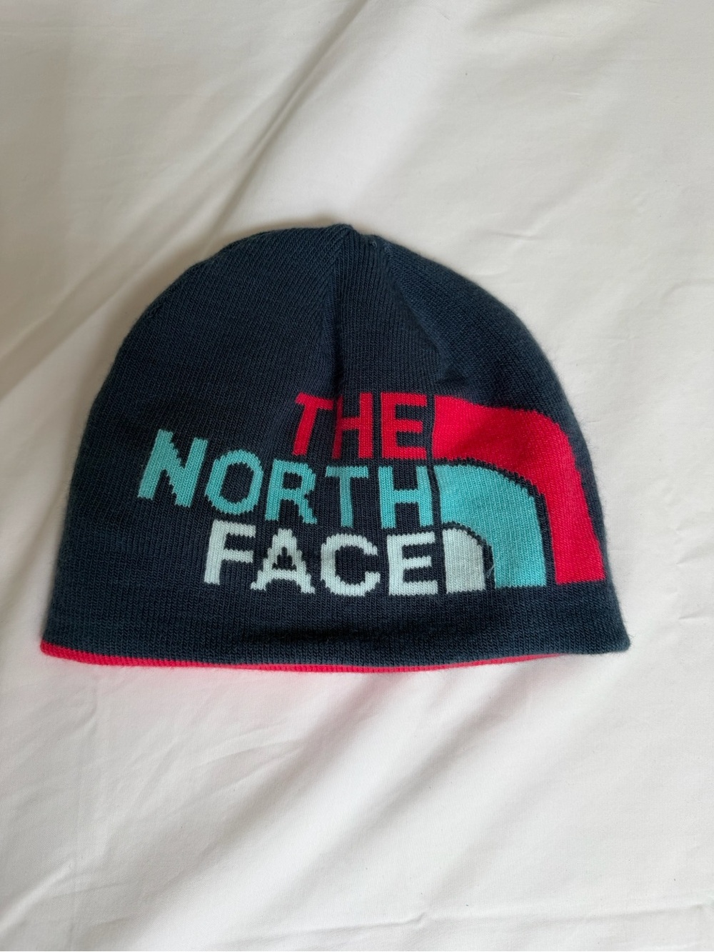 The North Face Navy Beanie with Teal & Pink Logo